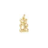 Gold teddy bear pendant on a white background